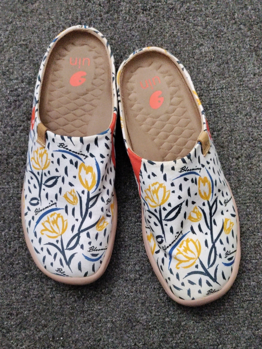 UIN White Canvas Slip-Ons with Yellow Floral Print and Navy Accents